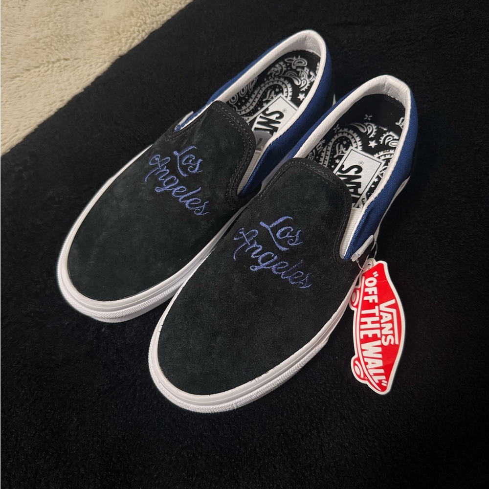 Vans Black and Blue Slip-On Sneakers with Classic Design